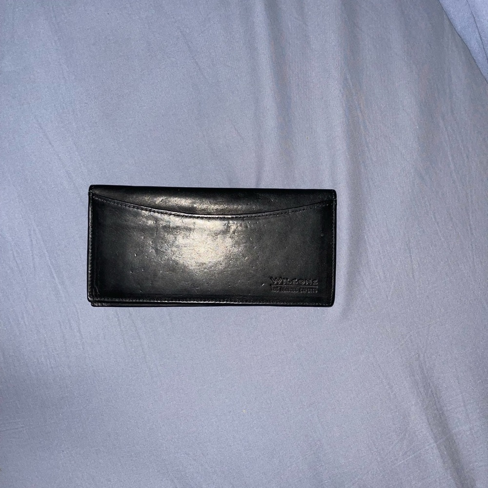 Wilson’s genuine black leather check book.